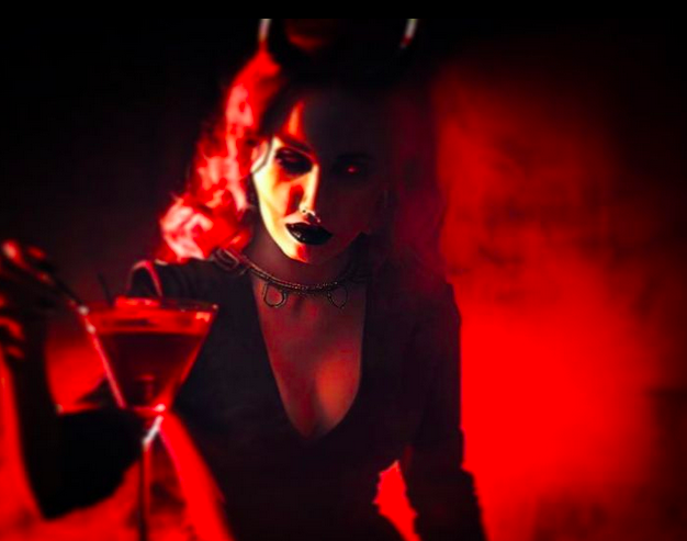 woman with horns holding a cocktail