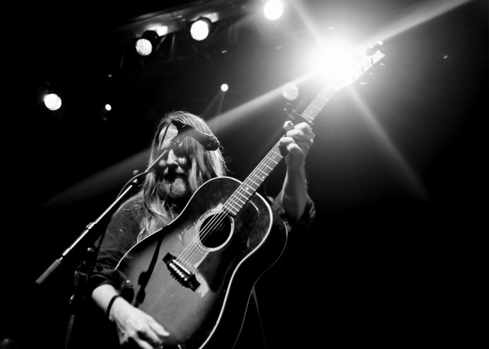 man playing a guitar