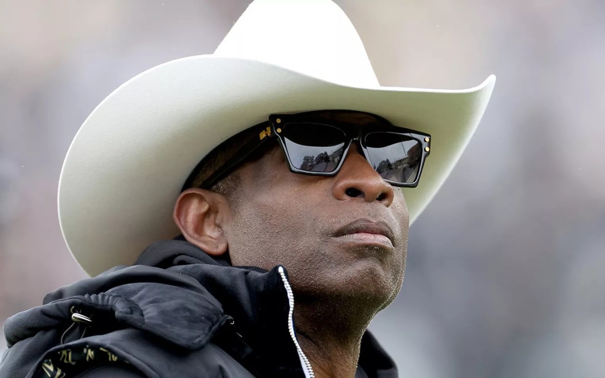 black man in sunglasses and cowboy hat