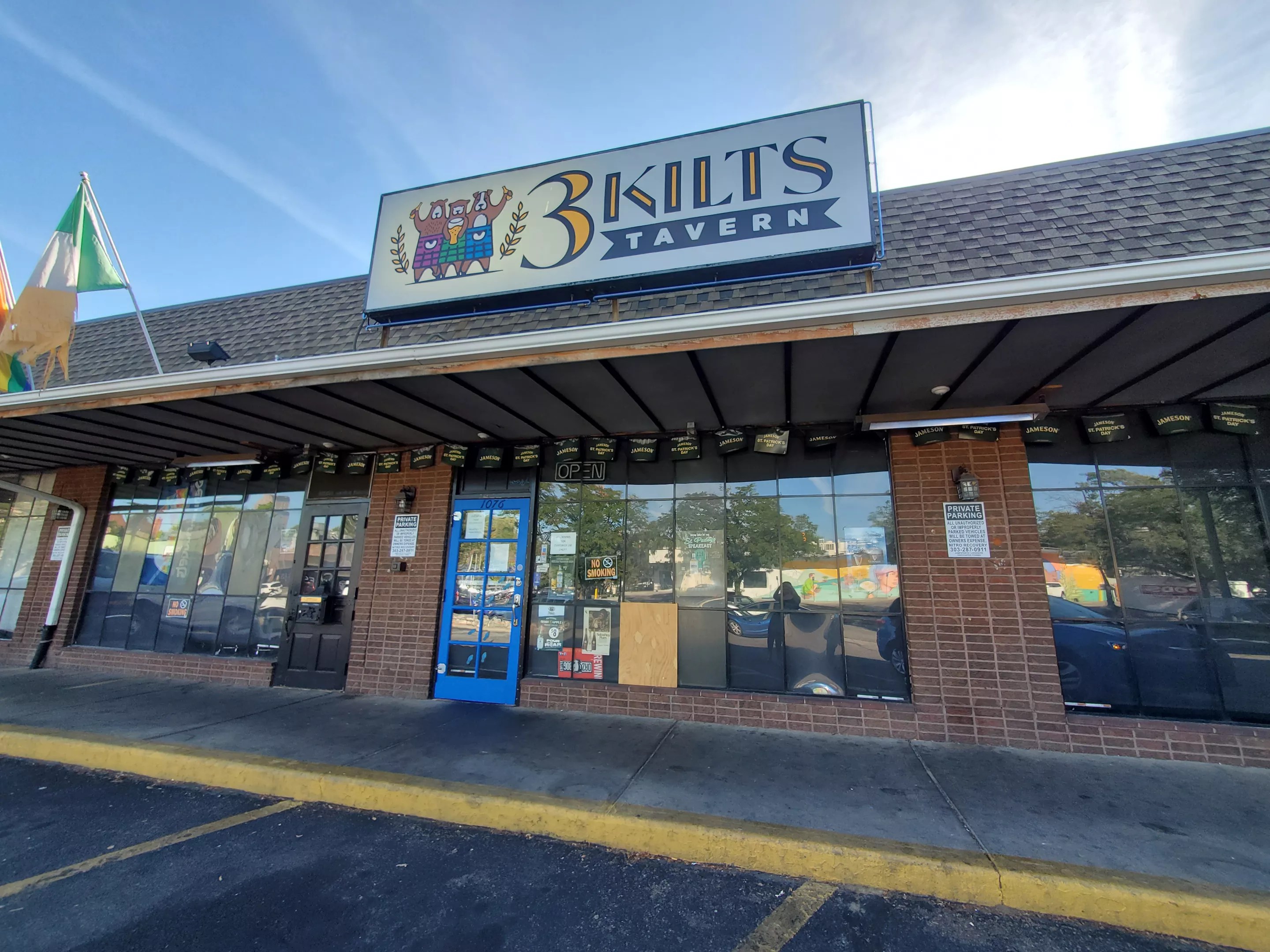 a sign on the front of a strip mall building