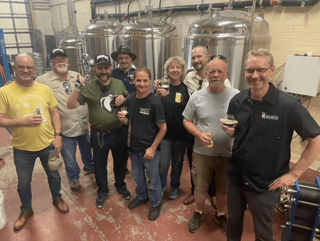 Group of men in a brewery