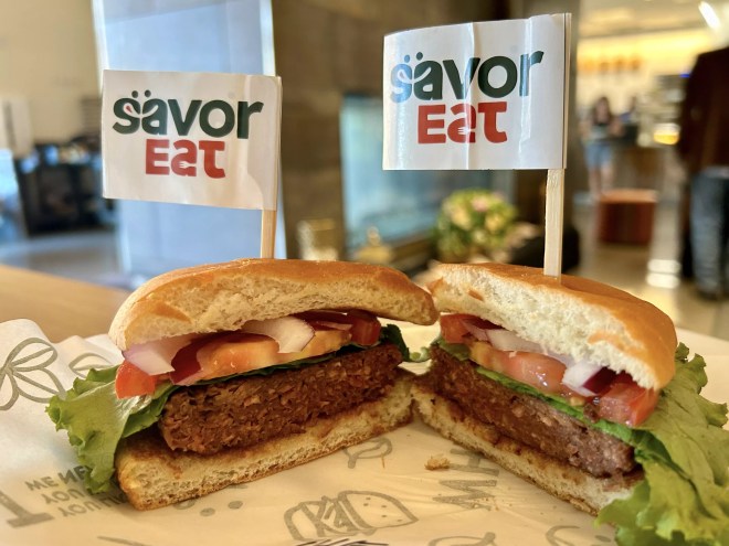 a plant-based burger cut in half