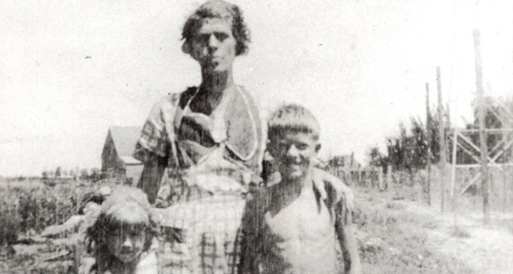 woman and two children on farm