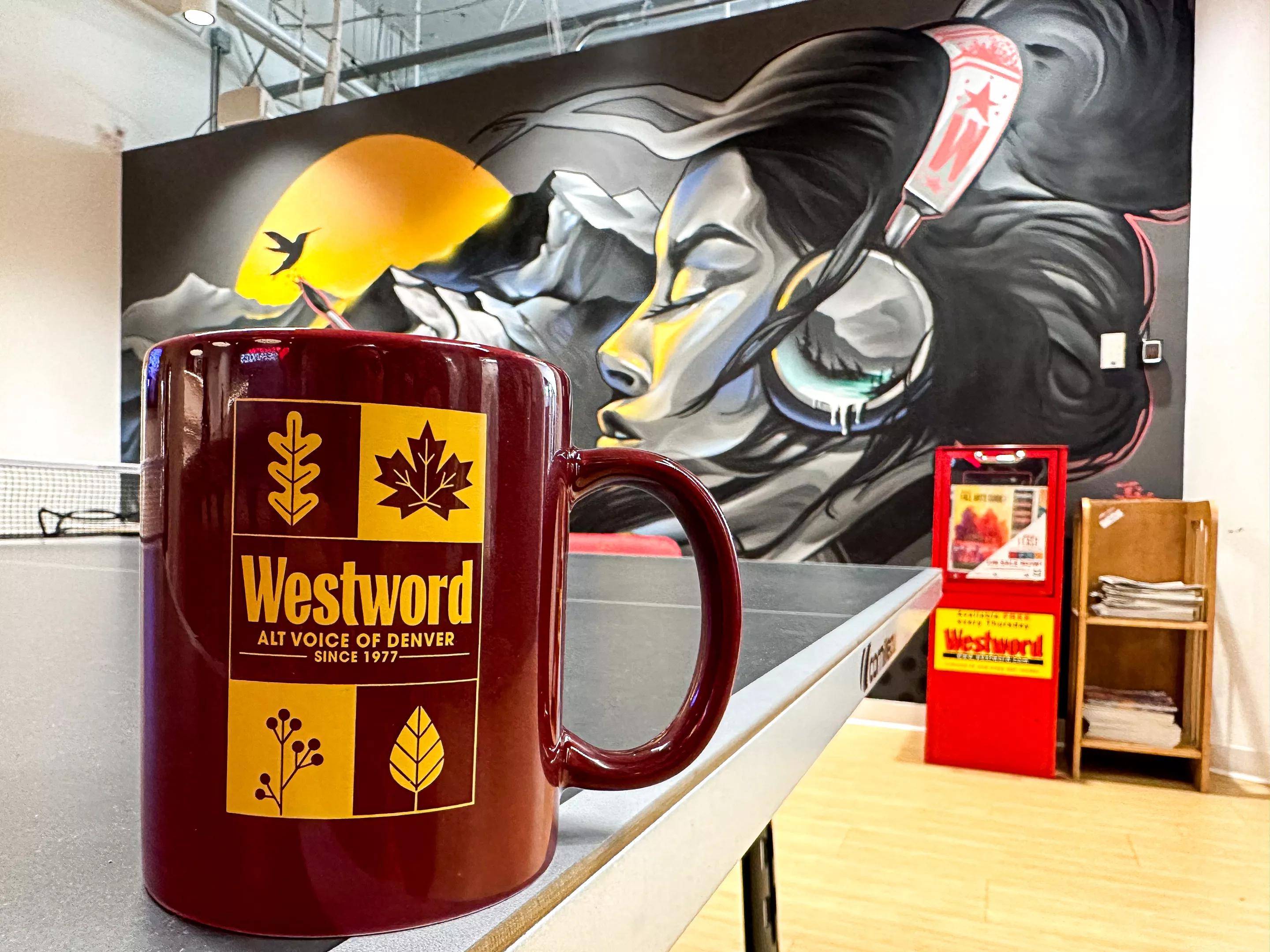 Maroon coffee mug with gold text