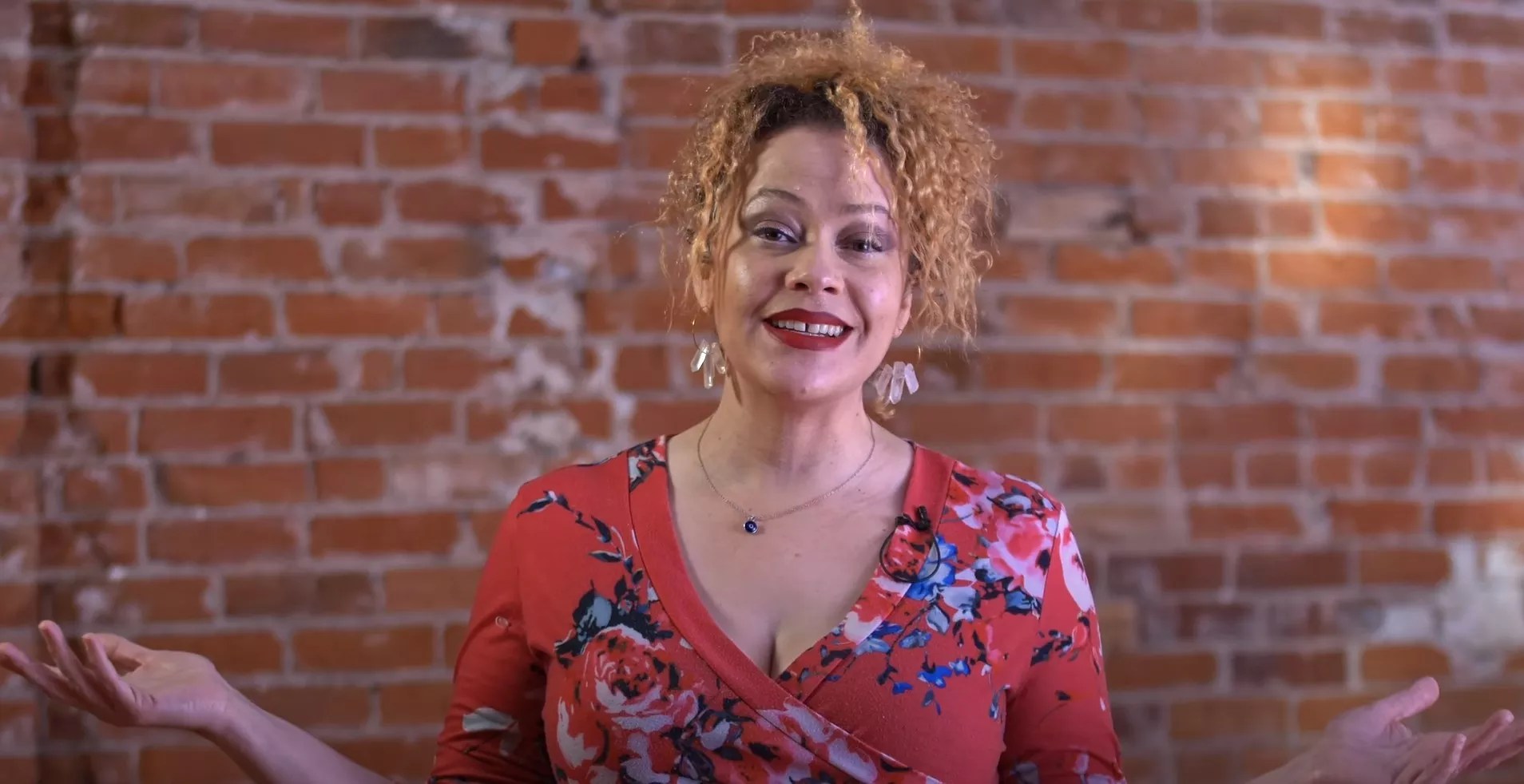 woman wearing red lipstick in a red shirt