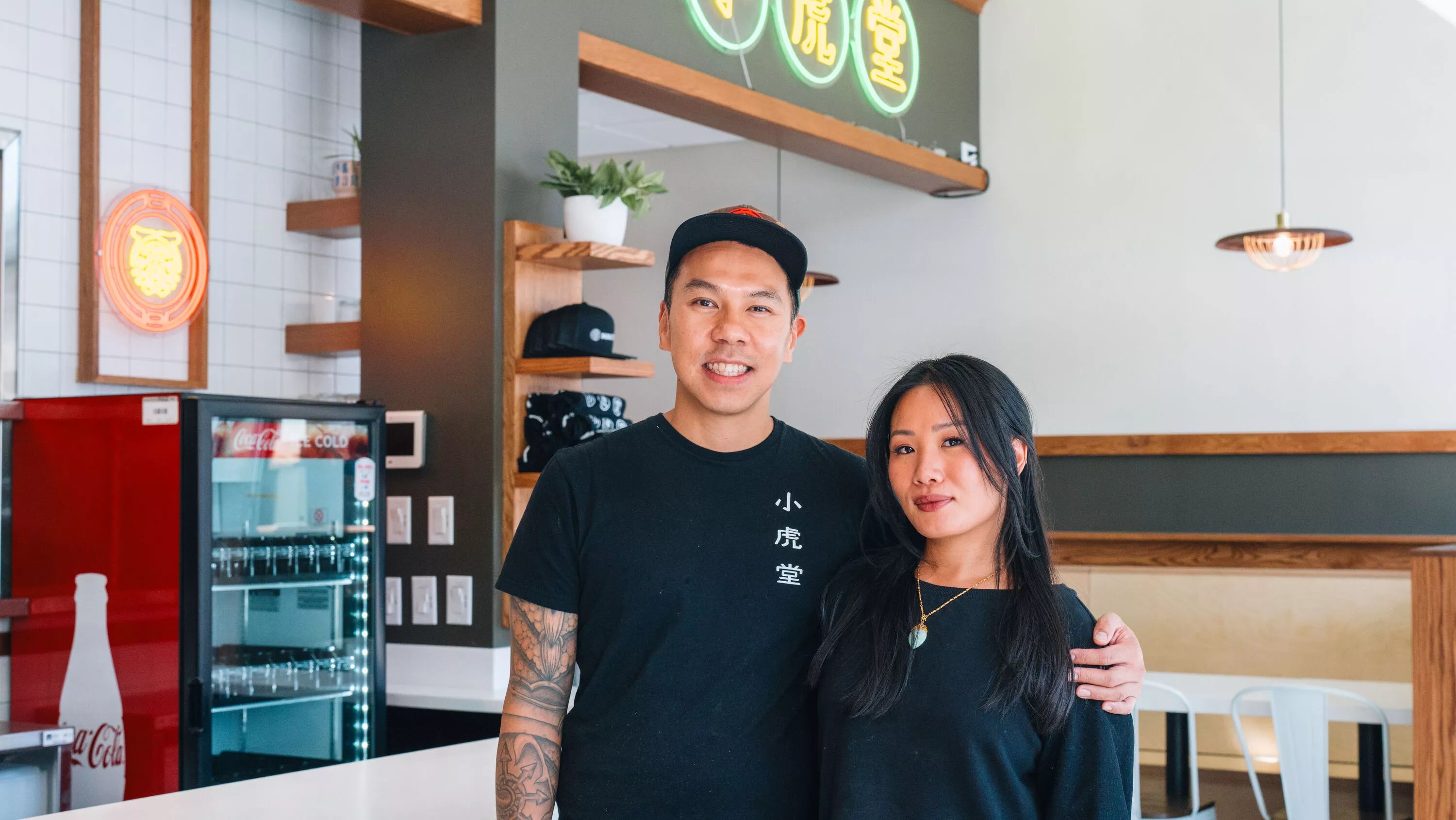 a man and a woman in black shirts