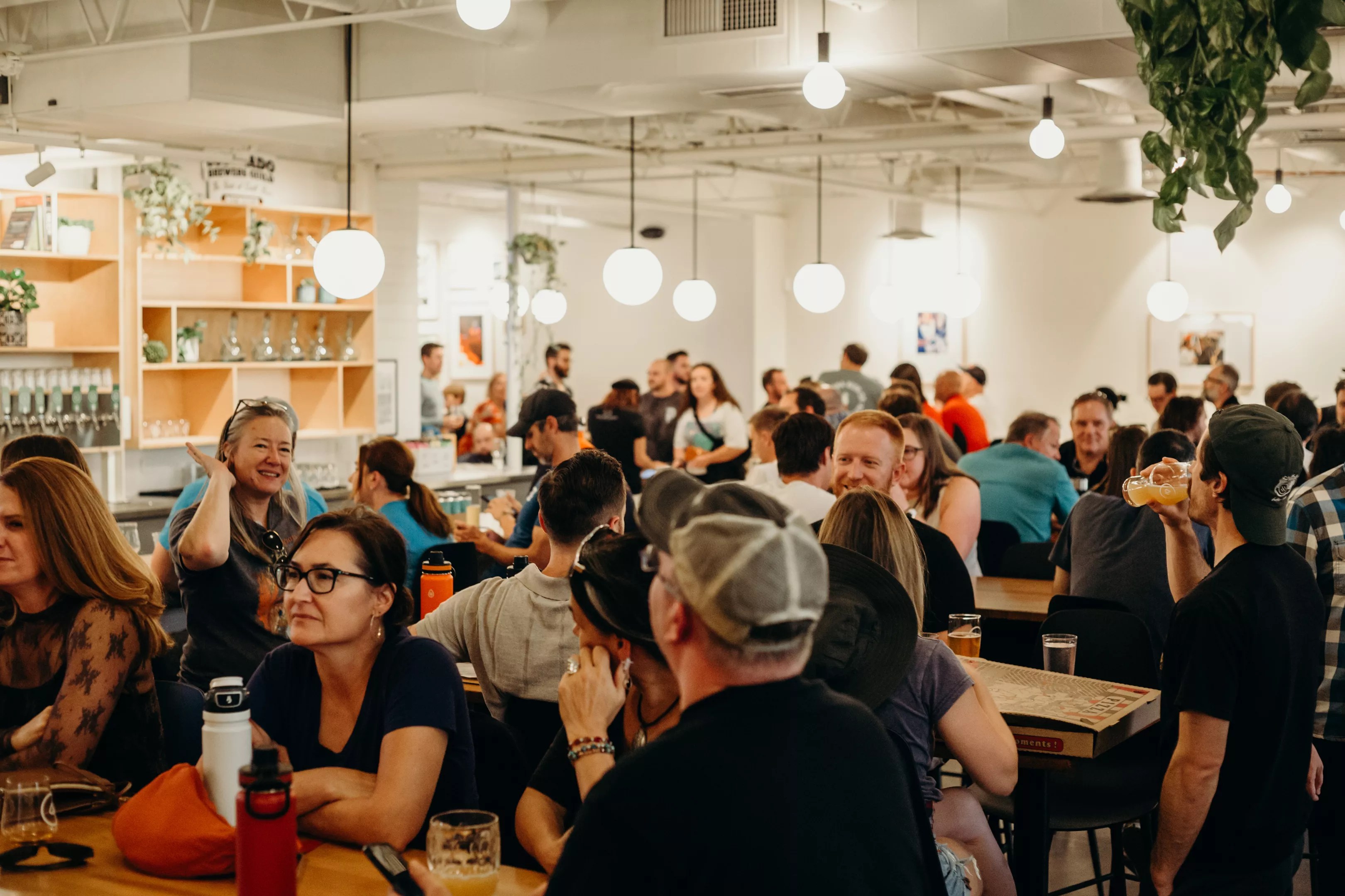 a crod of people inside a brewery