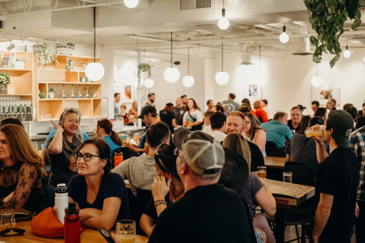 a crod of people inside a brewery