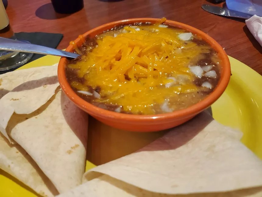bowl of chili with cheese.