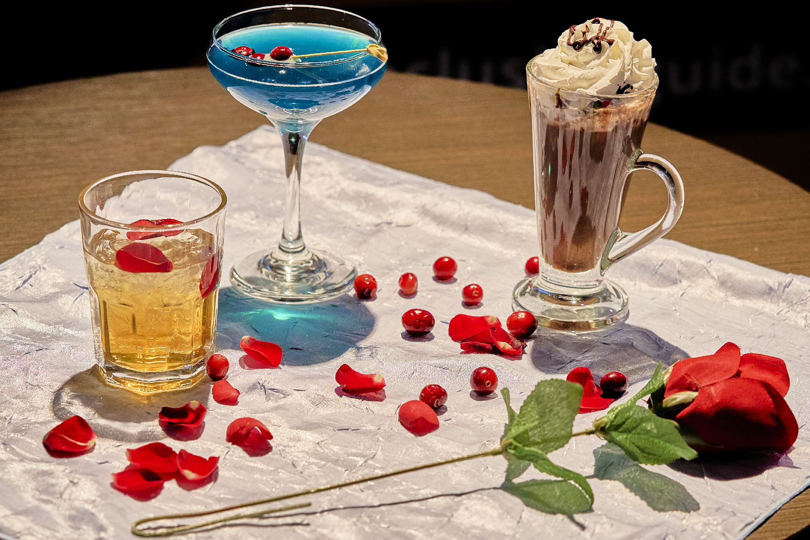 various cocktails and a rose