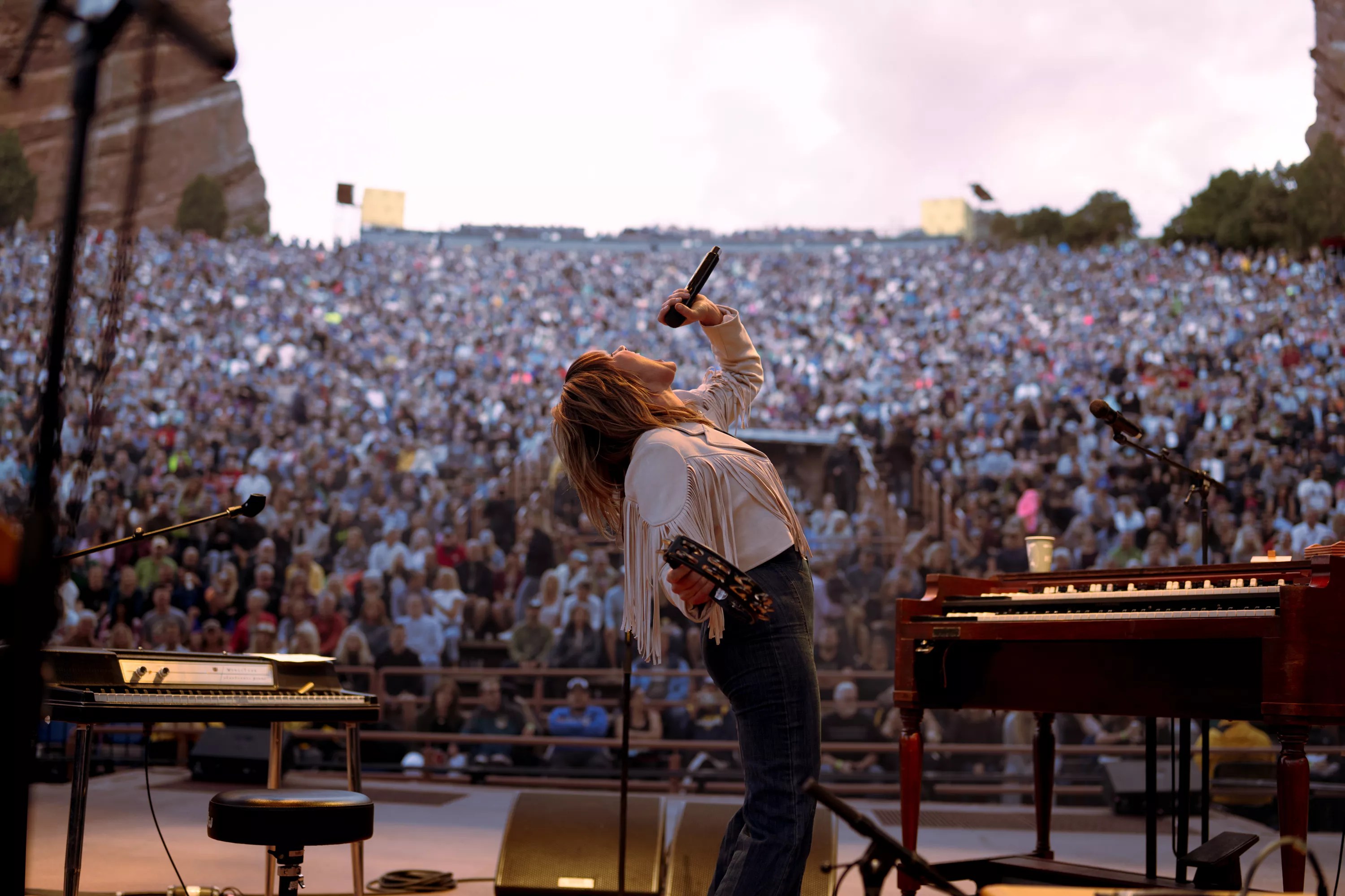Woman sings in front of crowd