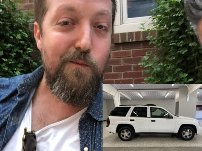 Blue Pan Pizza worker Nick Cordova petting a puppy.