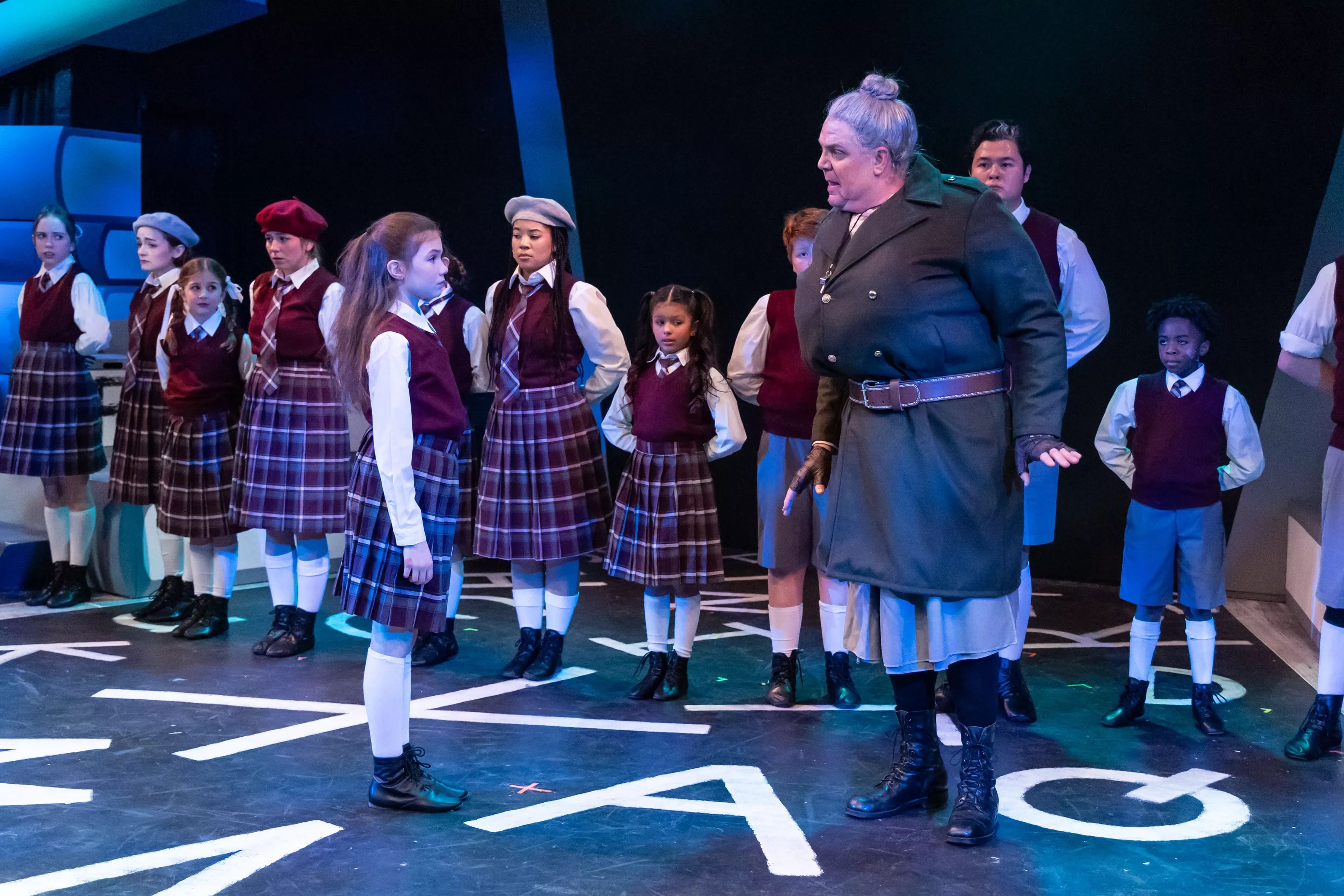 actors in Matilda the Musical on stage.