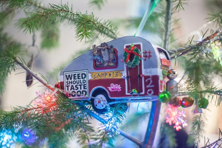 A trailer ornament hangs from a Christmas tree