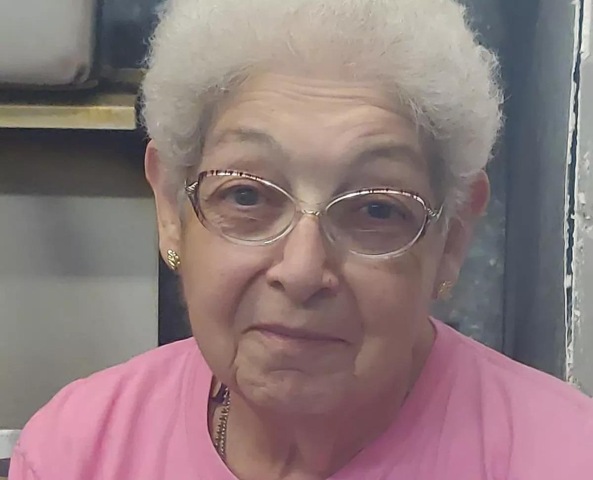 woman in pink shirt, glasses