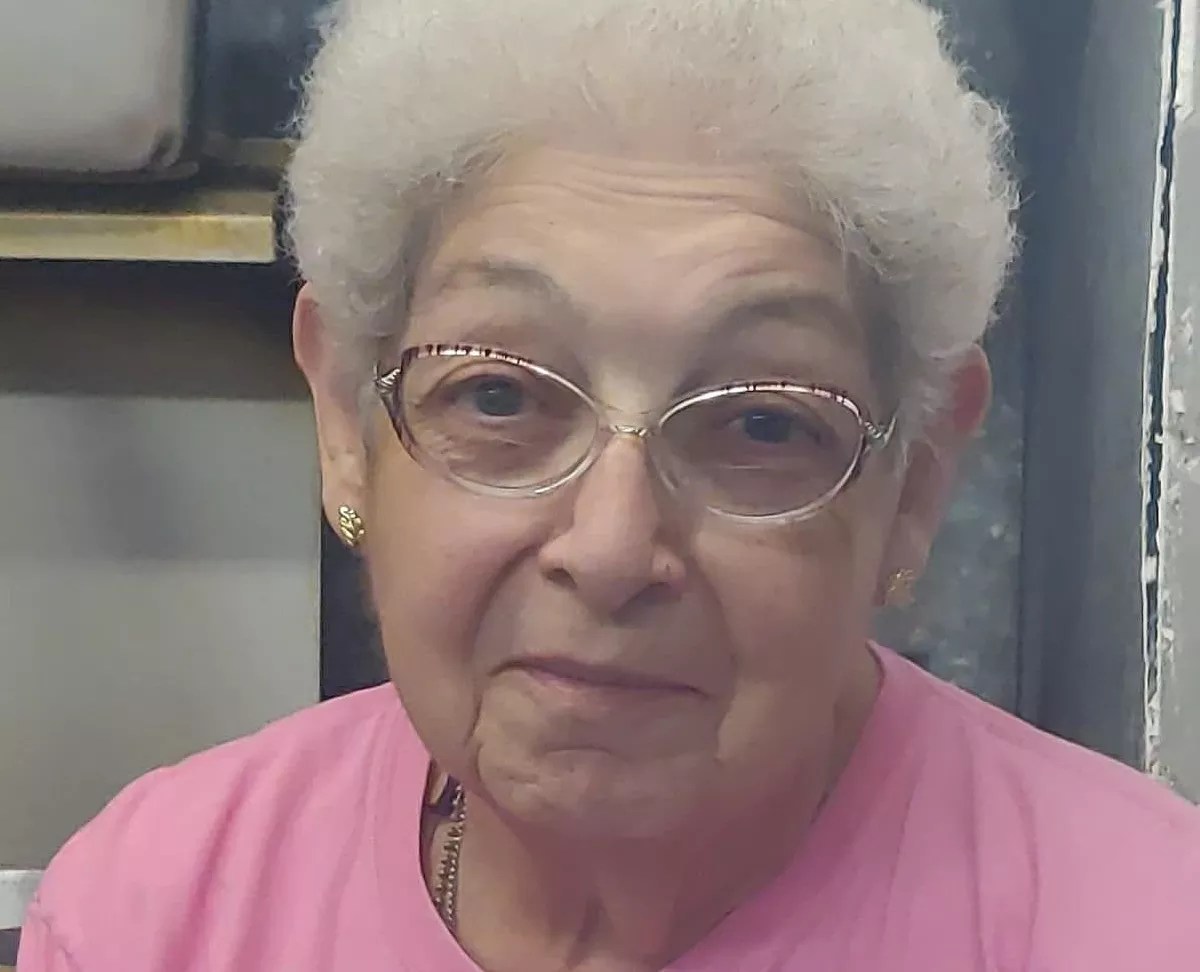 woman in pink shirt, glasses