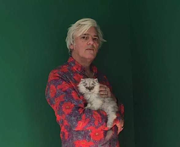 man in red shirt with cat