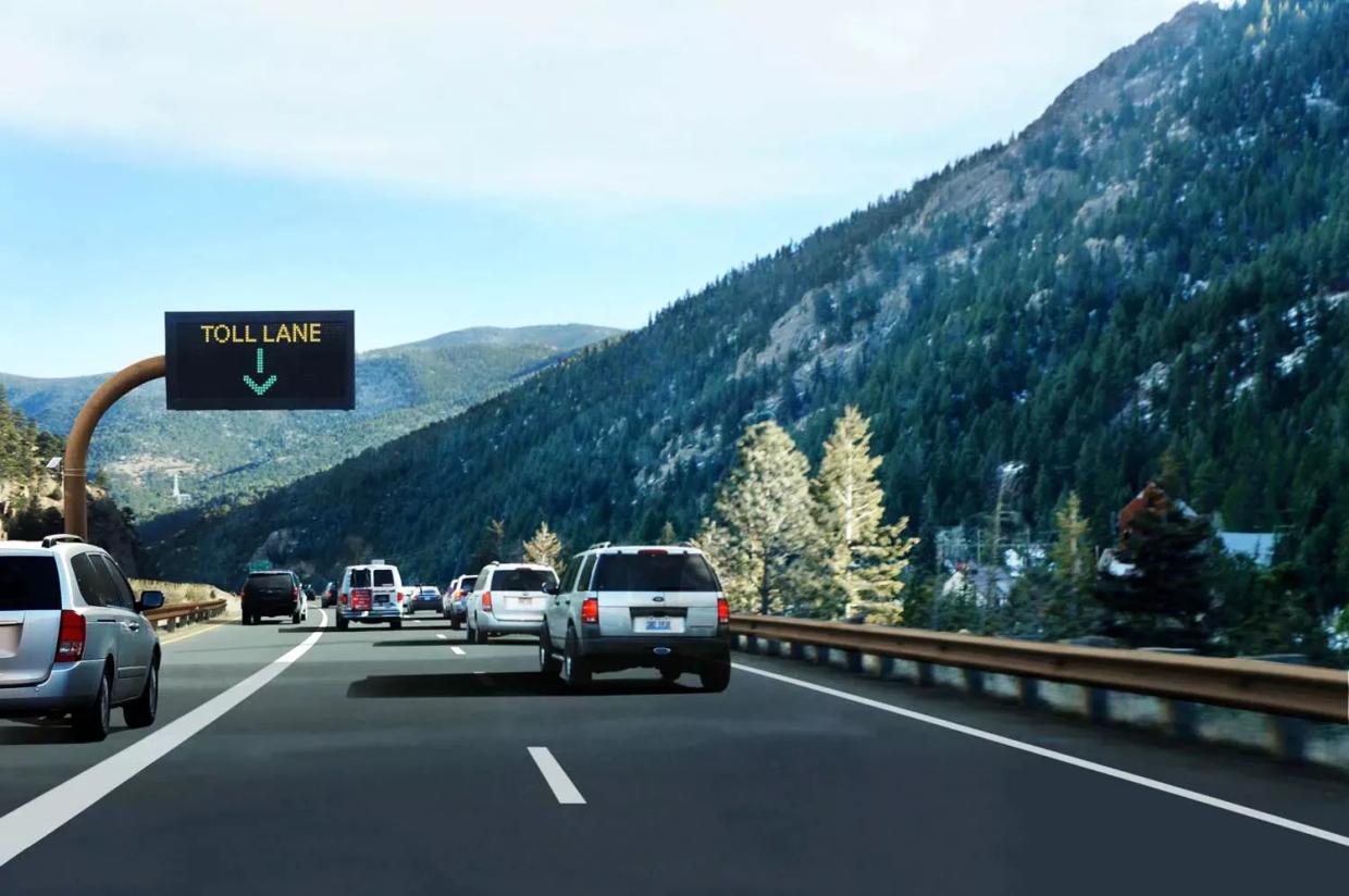 Vehicles driving along the Interstate 70 Mountain Express Lane.
