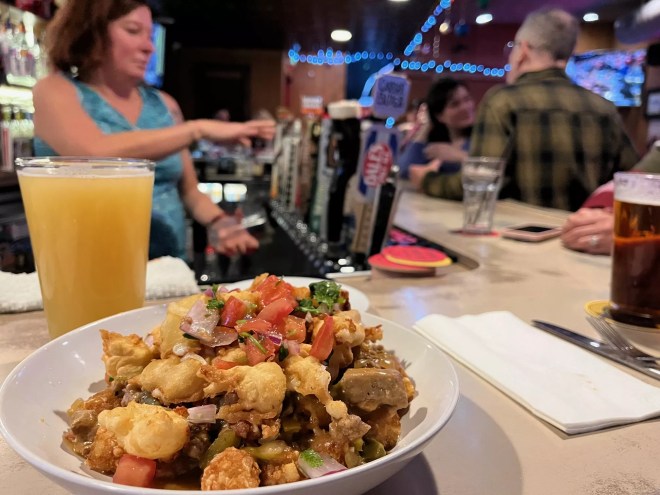 fried cheese curds on top of fries