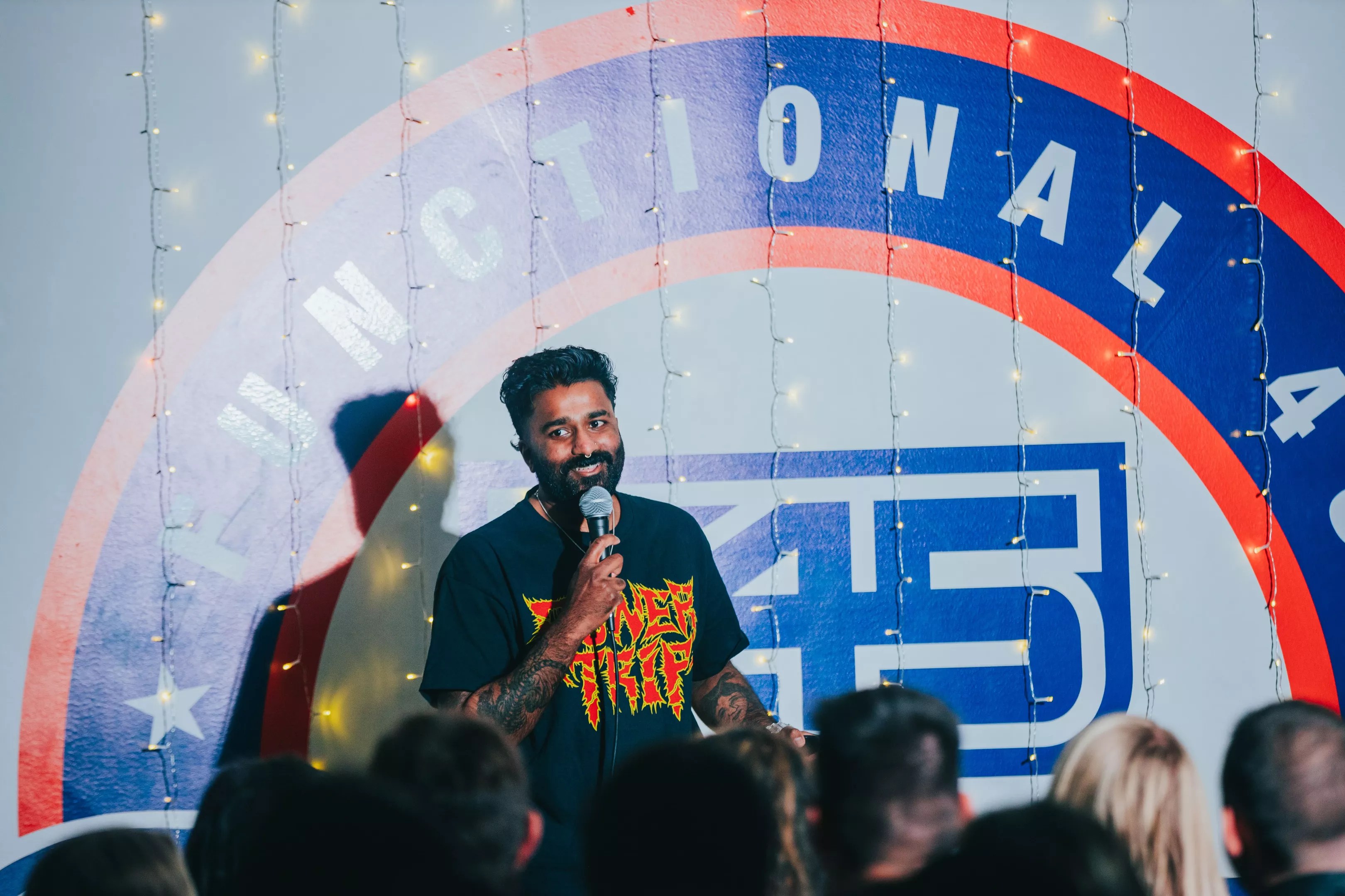 standup comic with microphone