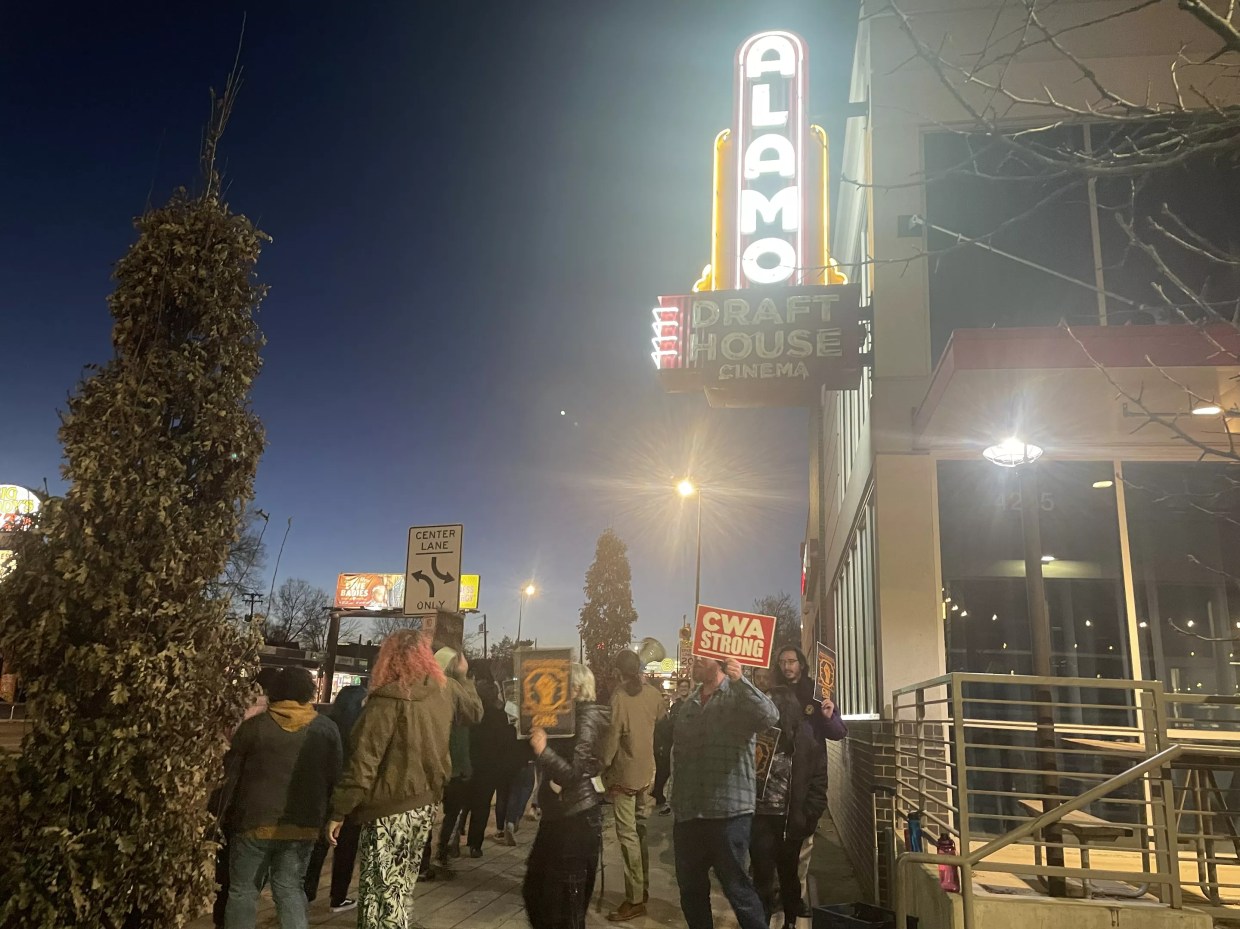 A crowd of people outside of Alamo Drafthouse.