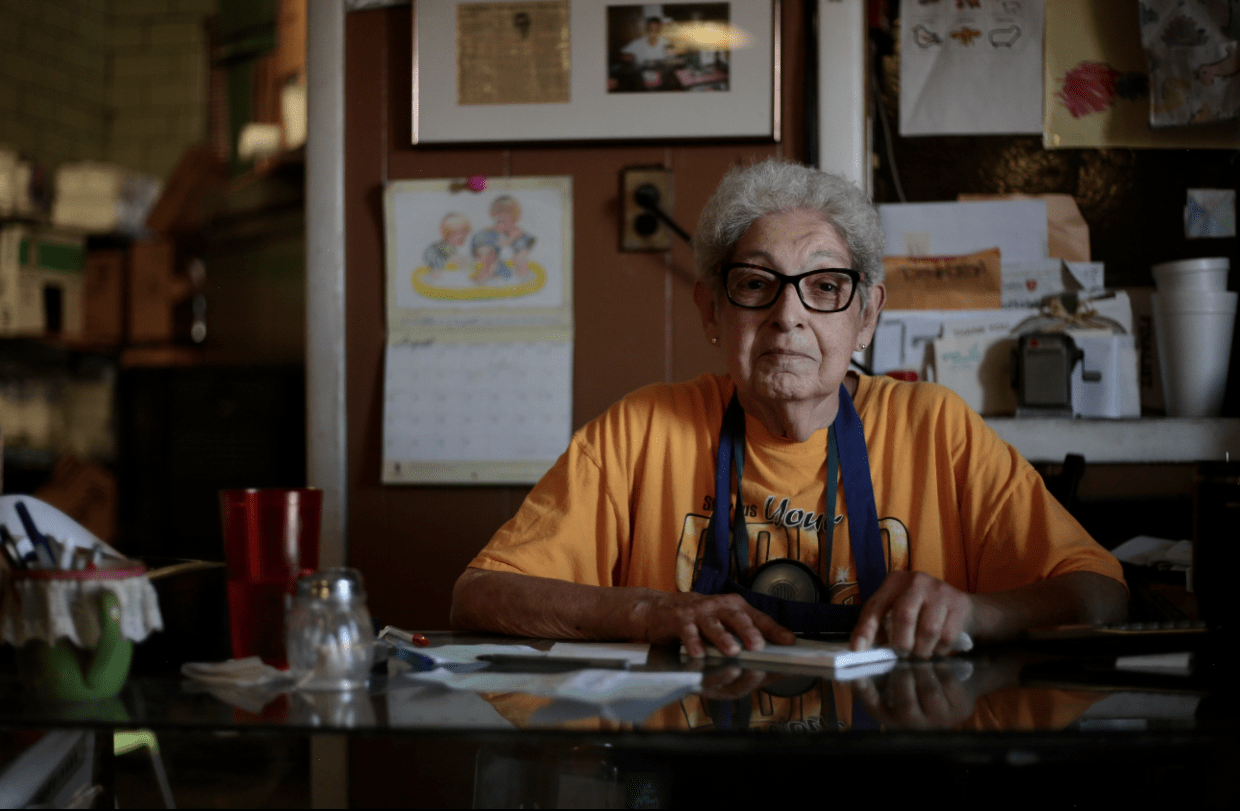 older woman at restaurant table