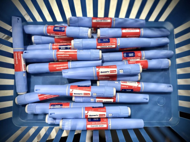 Basket of blue Ozempic syringes