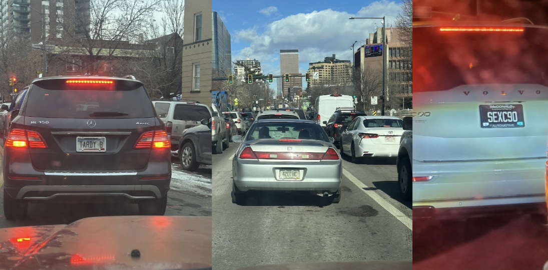 Cars driving with various vanity plates.