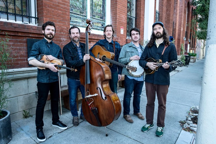 a bluegrass band poses for a picture