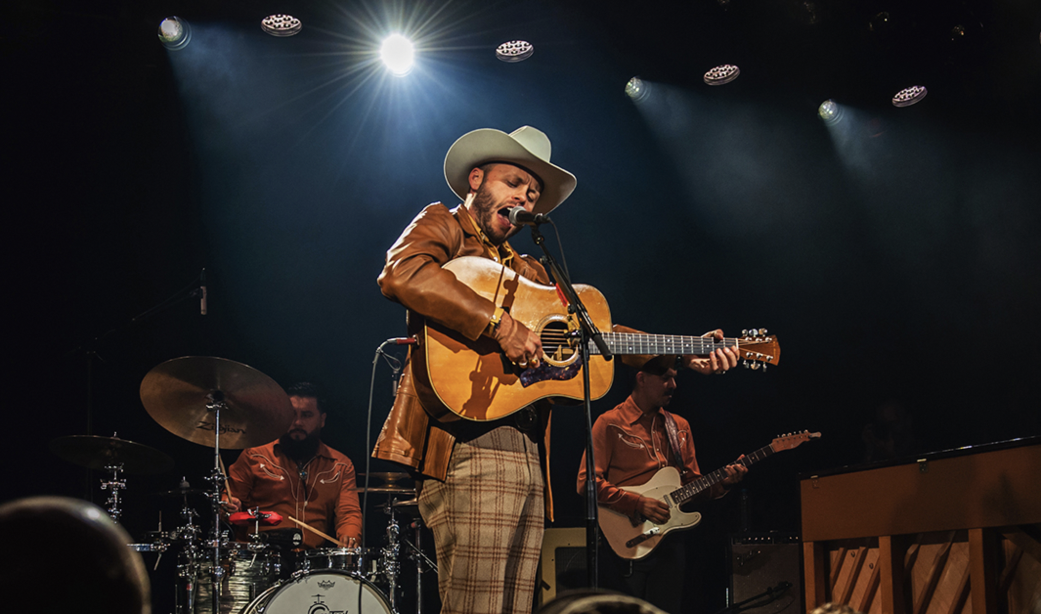 man playing acoustic guitar