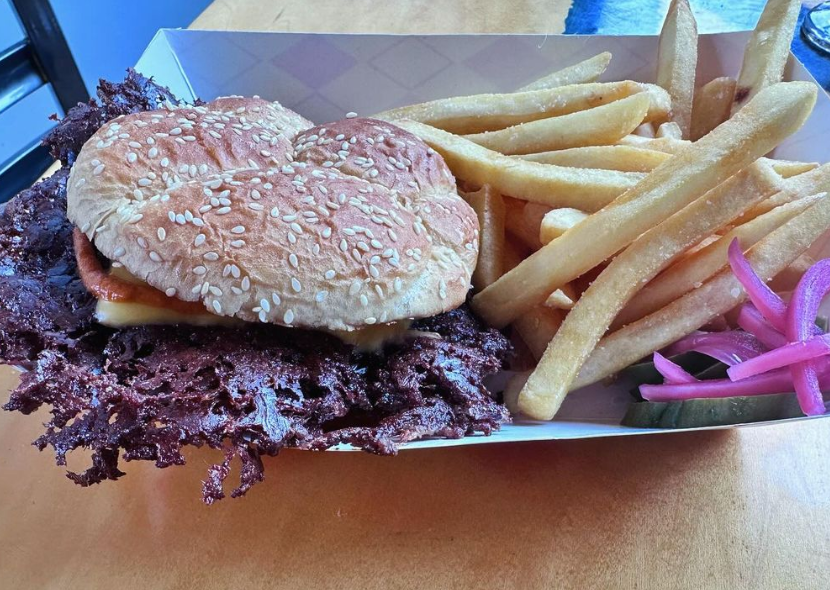 a cheeseburger with very thin patties