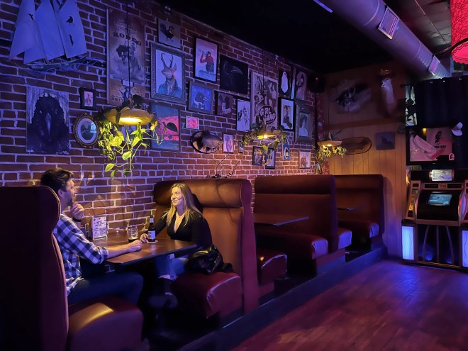 a man and a woman sitting in a booth