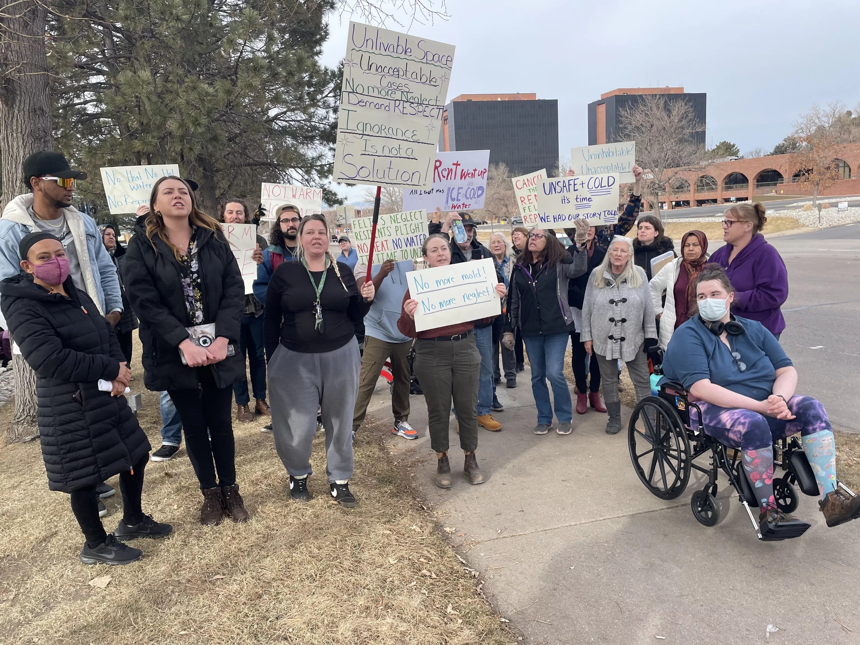 a group of people holding posters
