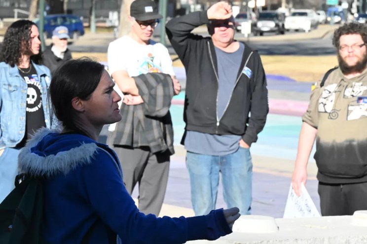 HAND activists rally in front of City Hall.