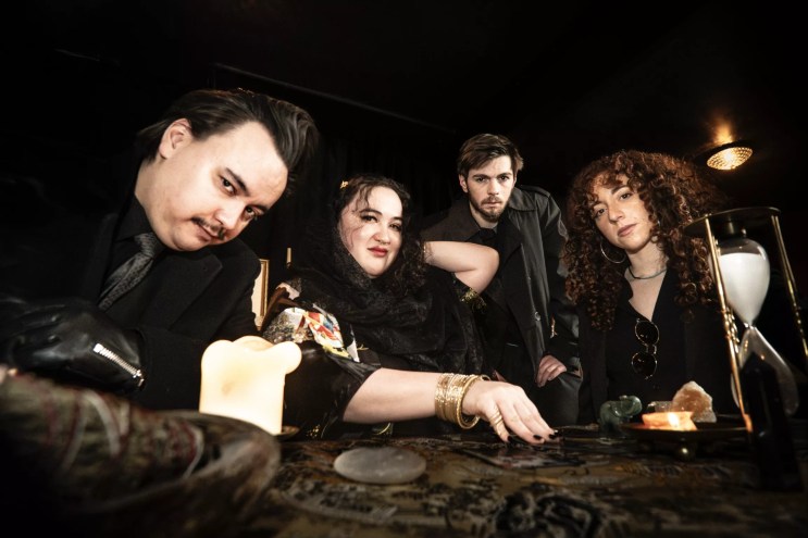 bandmates smile for a photo