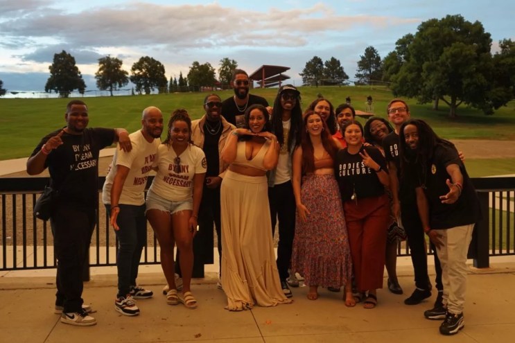 a group of people smile for a photo