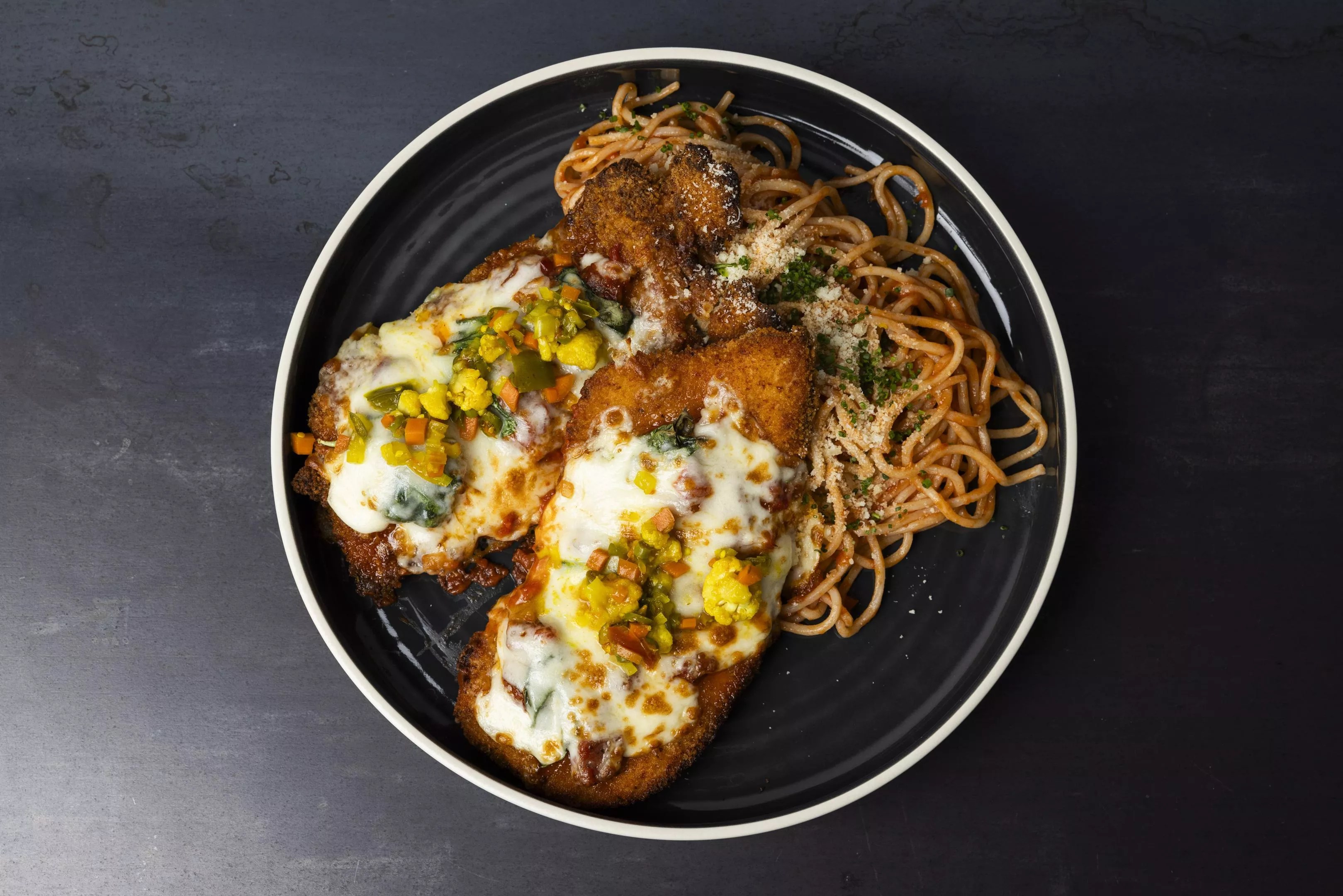 chicken parm with pasta on a plate