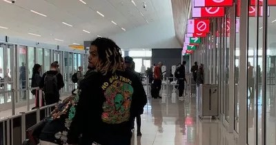 man with "no bad trips" on sweatshirt.