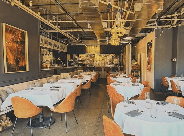 inside of a restaurant with with set tables