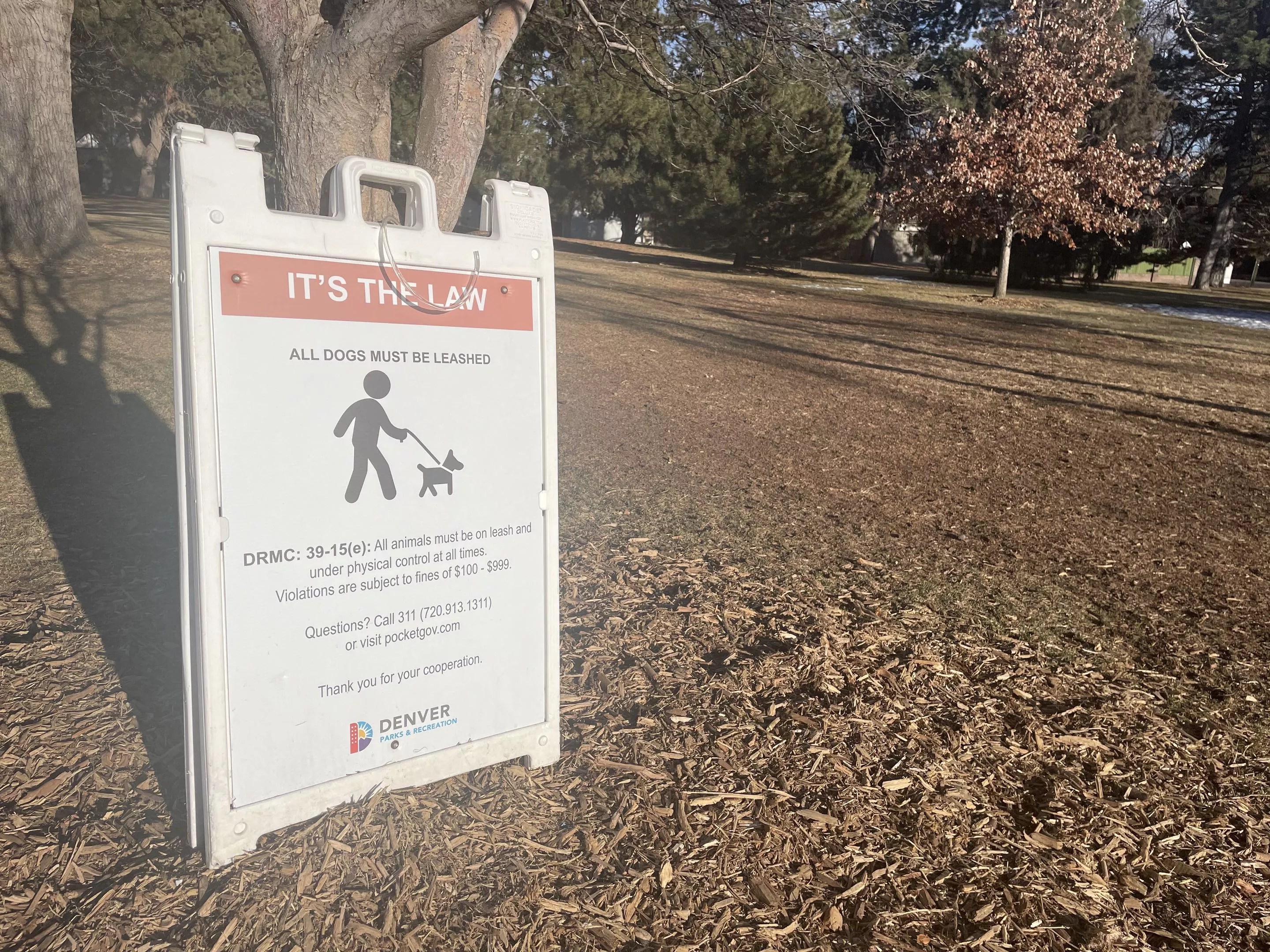 sign in park about dogs