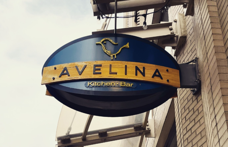 a blue sign that says "avelina"