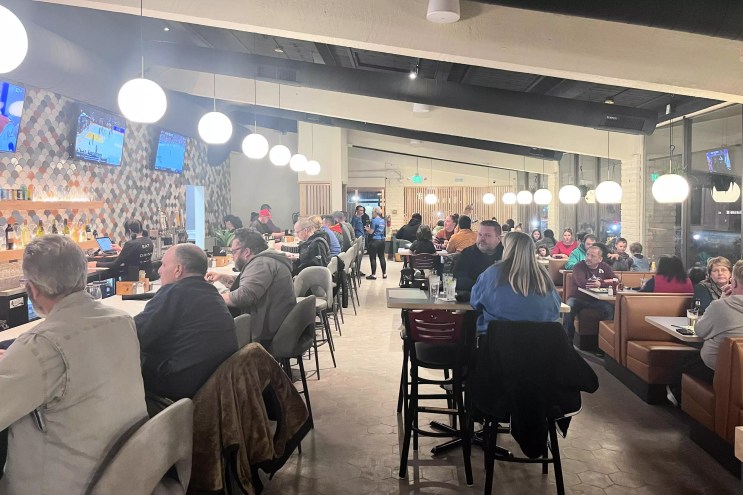 Patrons seated inside a restaurant