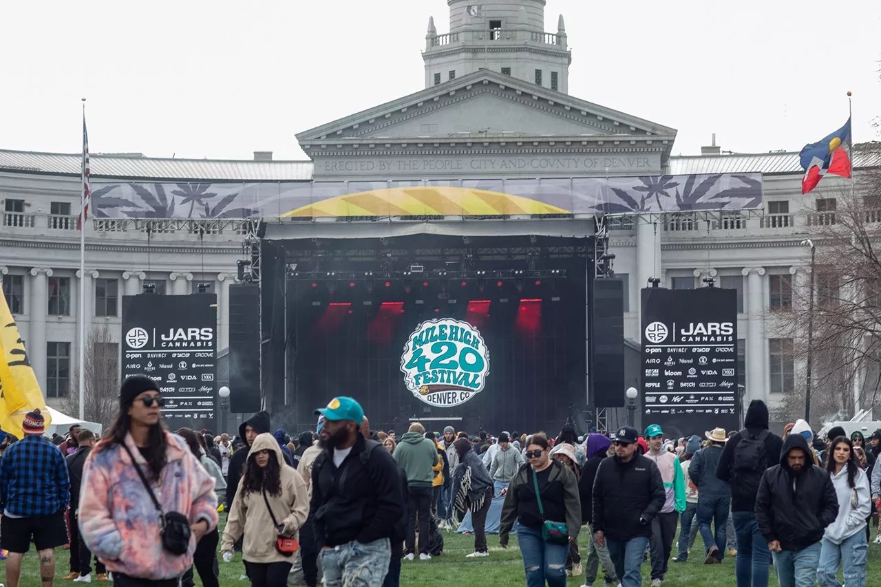 Concert crowd stands in front of the stage at Denver City Hall building on 4/20