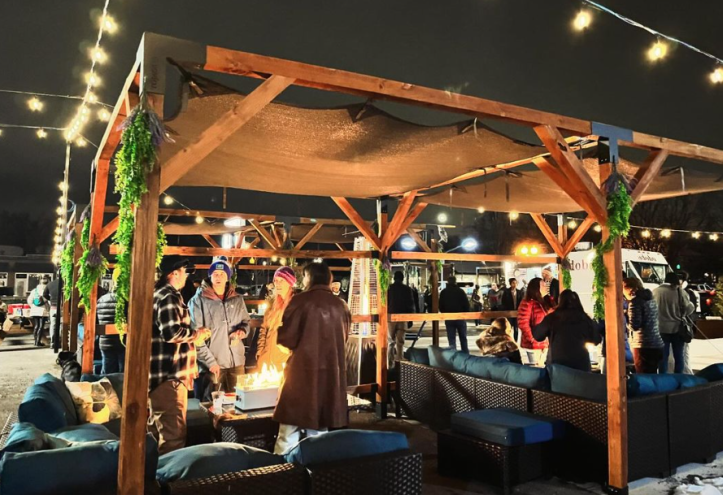 people gathered under a pergola