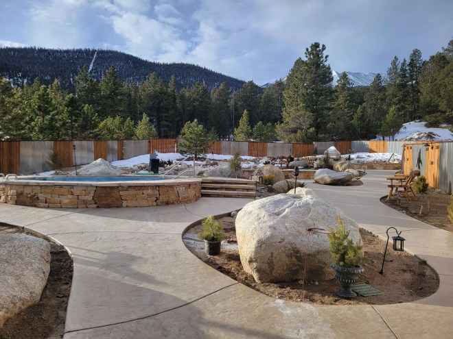 Paved paths leading to stone pools at Charlotte Hot Springs