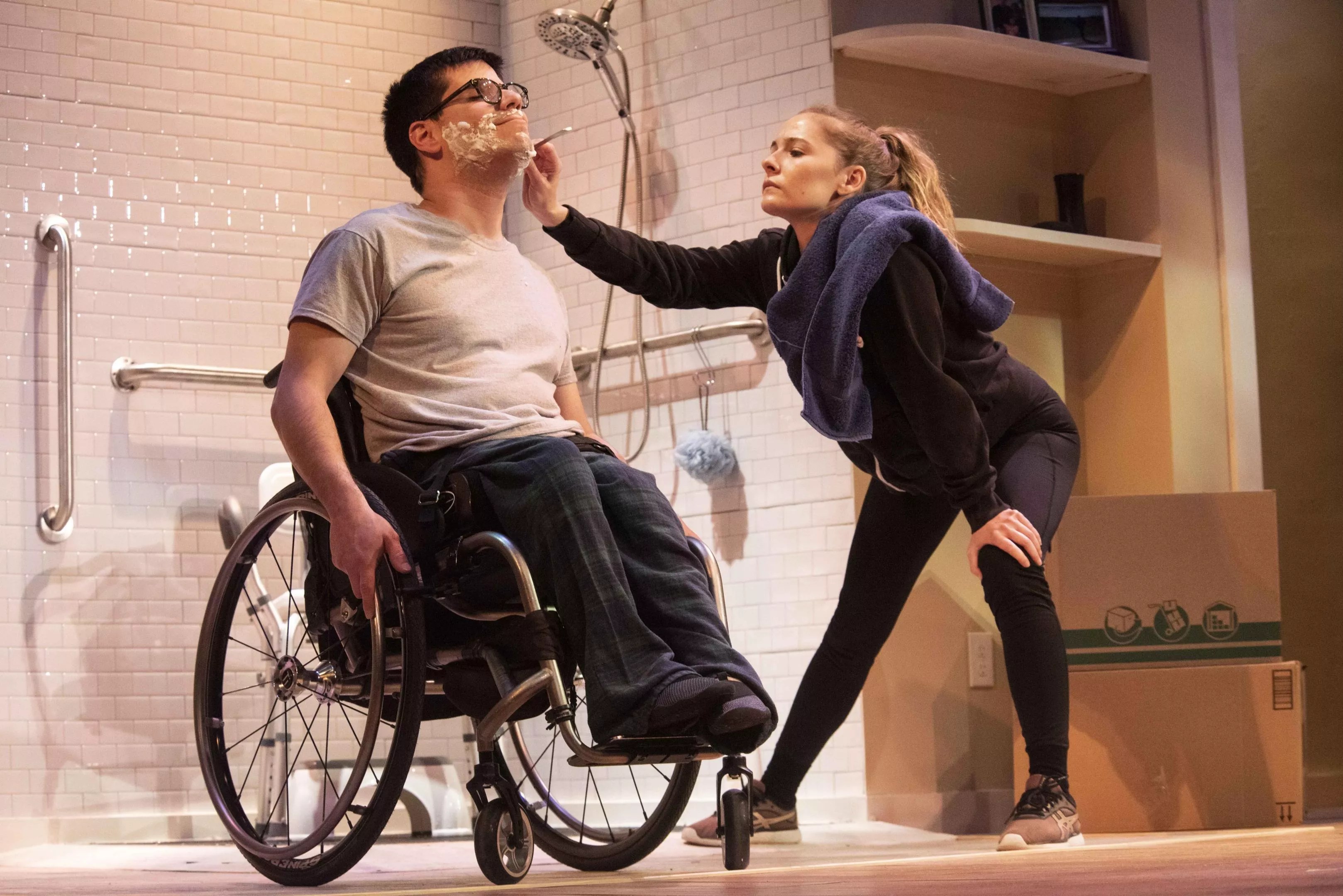 person in wheelchair being shaved