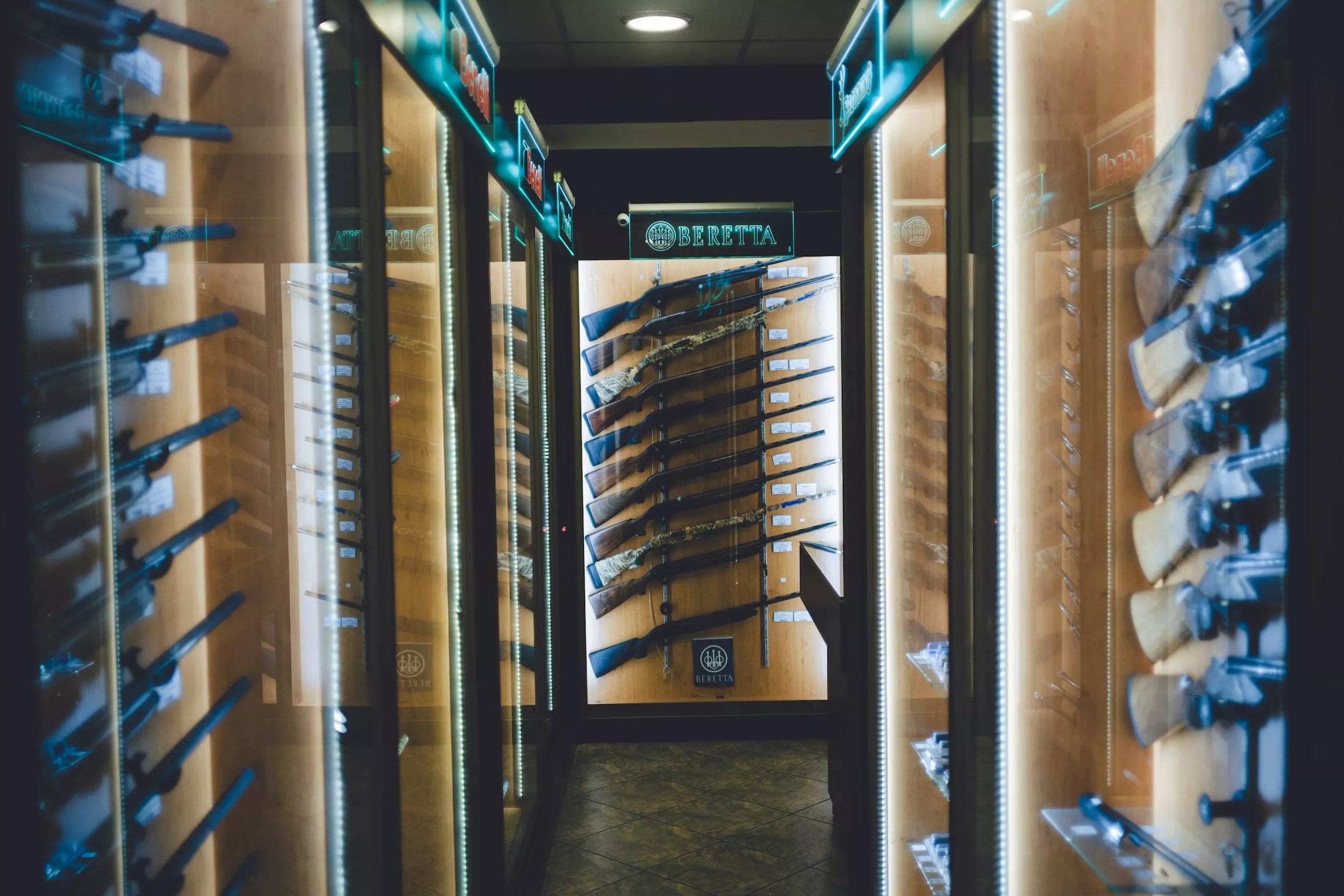 Racks of rifles for sale inside of a gun store
