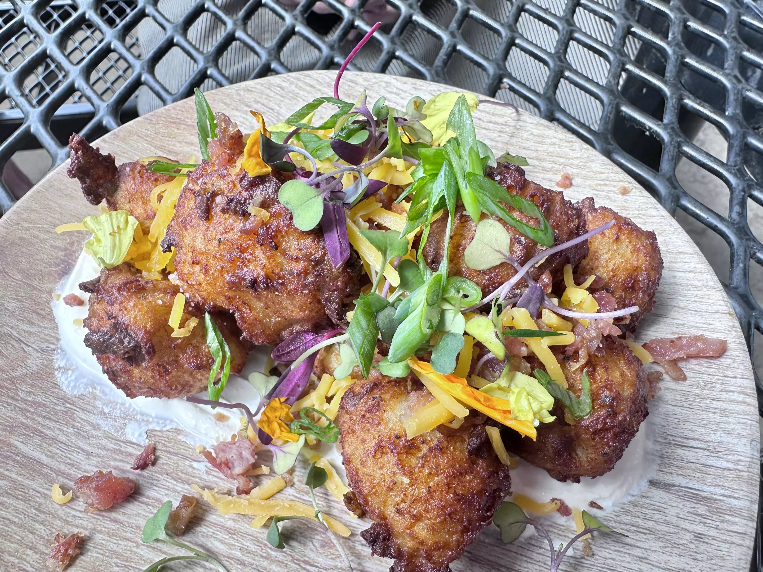 tater tots garnished with greens