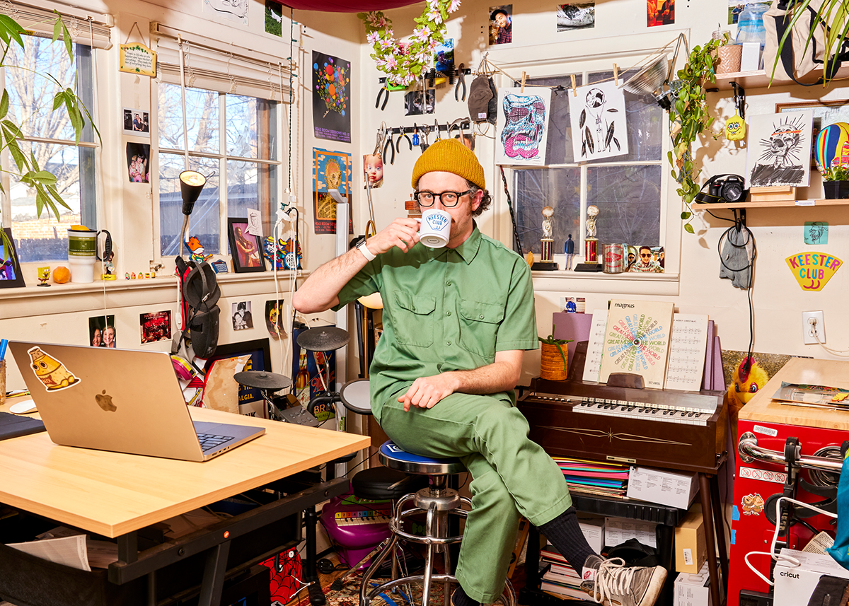 artist sitting in a studio drinking coffee