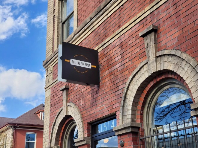 a sign on a brick building